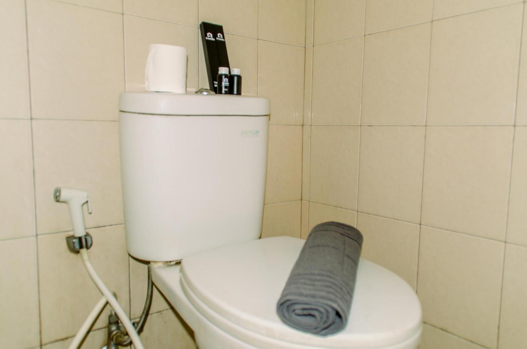 Apartment Homey And Warm At Tifolia By Travelio